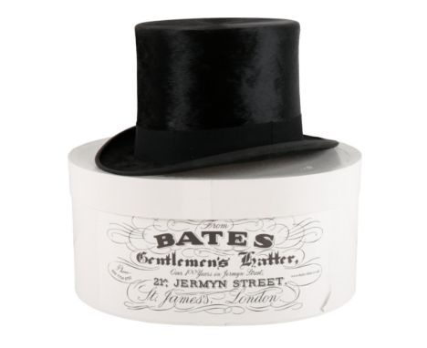 A BLACK SILK TOP HAT BY 'WEST &amp; CO. HATTERS 29 CHEAPSIDE LONDON, E,C. ALSO FOREIGN AGENCIES' measuring 6 7/8", with later