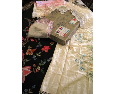 A vintage cream embroidered and tasselled shawl depicting flora, a vintage beige embroidered and tasselled shawl depicting fl