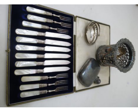 A cased set of Victorian mother of pearl bread and butter knives and forks, silver plated bottle coaster and hip flask