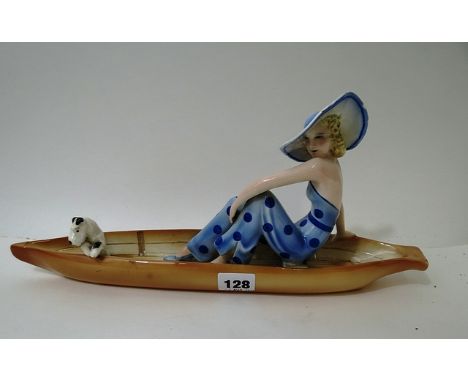 Austrian Goldscheider figure depicting a female and terrier dog in a boat A/F
