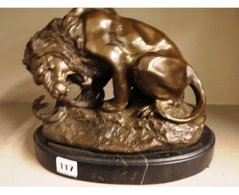 After Antone Louis Barye, a bronze sculpture of a lion and a serpent on a stepped oval marble base, 11 long