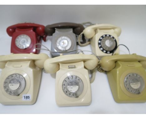 Group of six vintage finger-dial telephones in various colours to include a red coloured Bakelite and a mustard coloured Bake