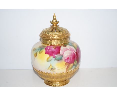 Royal Worcester floral lidded vase with pierced cover, signed to body M Hunt. 24cm
