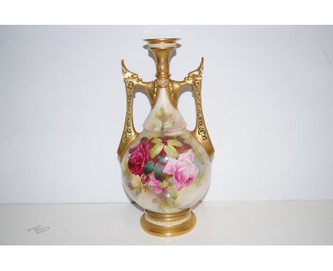 Royal Worcester twin handled vase with floral decoration, finely guided 36cm high. Puce back stamp