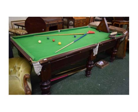 Riley 8x4ft snooker table with a slate bed and six heavy turned supports, together with snooker balls, an assortment of cues,