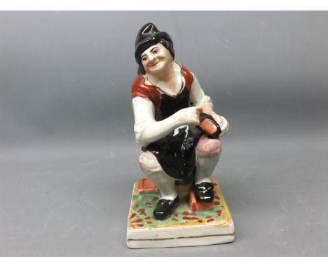 19th century Staffordshire model of a cobbler, 7ins tall 