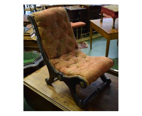 19th century ebonised nursing chair with decorative gilt mounts, embroidered seat with button detail, spindle supports 