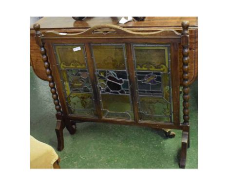Mid-20th century oak three stained glass panelled fire guard with bobbin turned supports, 32ins x 31ins  