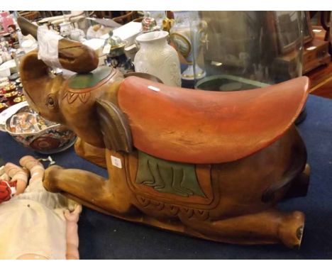 Eastern hardwood carved child's rocking elephant with carved and painted detail (with damage to trunk), 25ins wide x 20ins ta