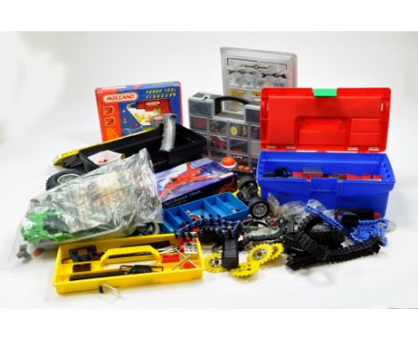 A large quantity of Meccano components, tools, parts and accessories partly contained in toolboxes etc. Various colour combin