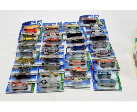 A large group of Mattel Hot Wheels Carded issues. Some harder to find early treasure hunts. All excellent to Near Mint. 
