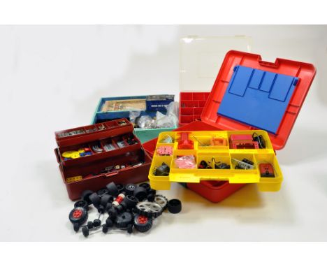 A large quantity of Meccano components, tools, parts and accessories contained in boxes, trays, toolboxes etc. Various colour