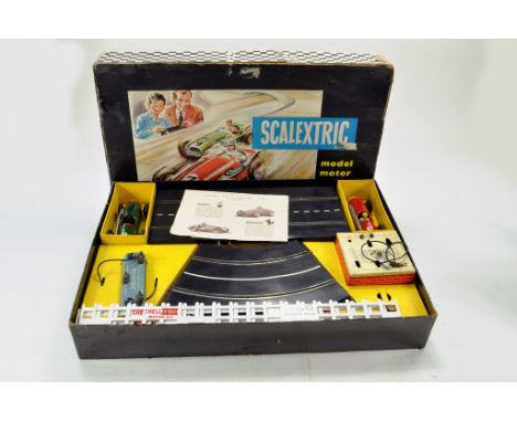 Scalextric very early issue slot car motor racing set comprising tin plate cars plus complete with track and accessories. Dis