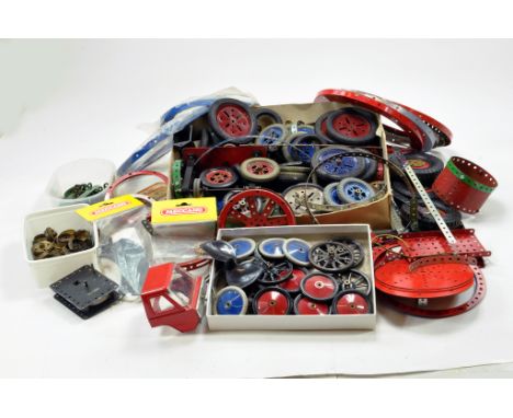 A large quantity of Meccano components, tools, parts and accessories. Various colour combinations in addition to many various