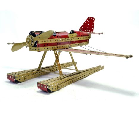 A finely constructed single engine aircraft from Meccano. Finished in red.