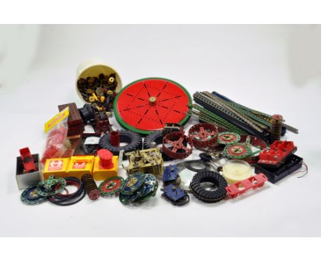 A large quantity of Meccano components, tools, parts and accessories. Various colour combinations in addition to many various