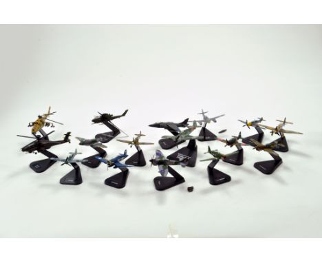 A group of diecast model aircraft on display stands Some with light damage. 