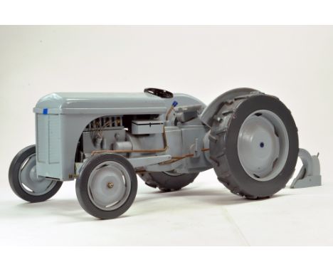 A hand built and crafted approx. 1/4 scale model of the Ferguson Tractor with rear linkage and Ferguson Plough. Predominantly