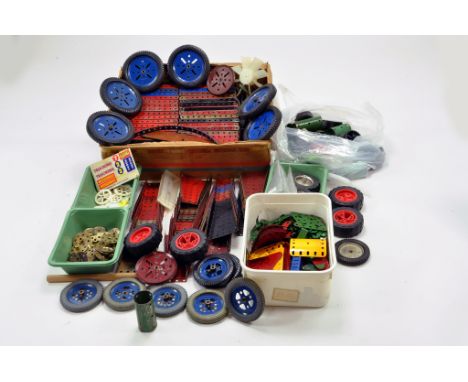 A large quantity of Meccano components, tools, parts and accessories. Various colour combinations in addition to many various