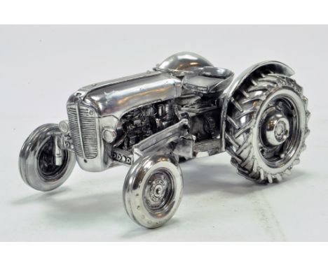 Unknown maker of a 1/16 Massey Ferguson 35 Tractor finished in chrome. Generally Excellent. 