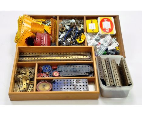 A large quantity of Meccano components, tools, parts and accessories. Various colour combinations in addition to many various