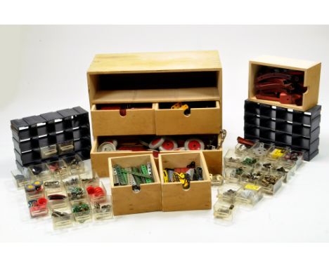 A large quantity of Meccano components, tools, parts and accessories contained in drawers. Various colour combinations in add