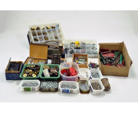 A large quantity of Meccano components, tools, parts and accessories contained in boxes, trays, toolboxes etc. Various colour