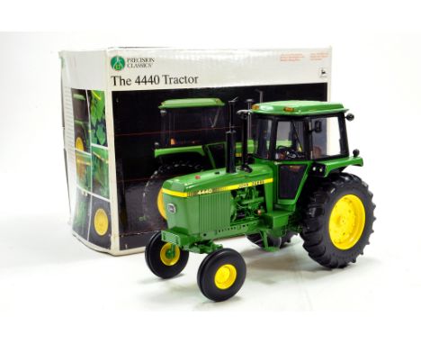 Ertl 1/16 Precision Series John Deere 4440 Tractor. Complete with Medal and Wheel Weights. Excellent in Box.