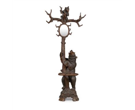 BLACK FOREST CARVED BEAR HALL STAND LATE 19TH CENTURY depicting a standing bear beside a tree, and a bear cub in the top bran