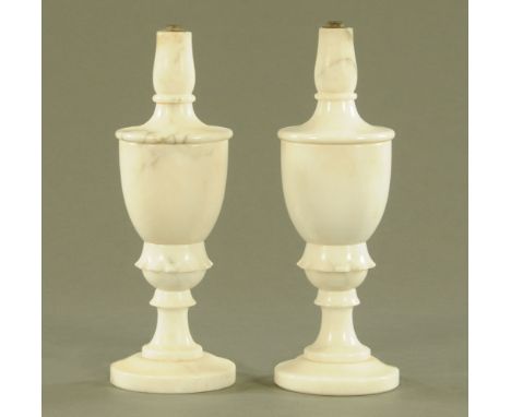 A pair of white marble table lamps, height excluding light fitting 30 cm. CONDITION REPORT: The lamps do have light fittings.