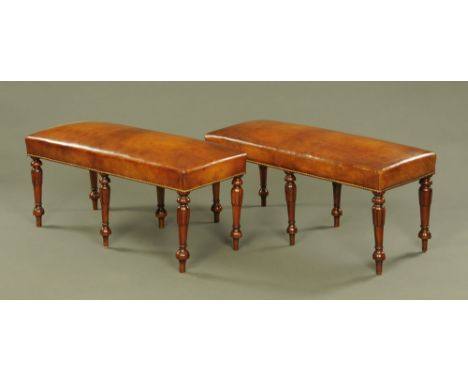 A pair of Victorian style stools, brown leather upholstered and studded and raised on six turned and carved legs.  Height 47.