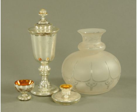 A late 19th century Continental cased and silvered glass lidded goblet. Height 36 cm, a similar etched squat candlestick and 