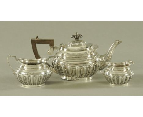 A three piece silver half lobed tea service, of small size, Birmingham 1902, 428 grams gross (see illustration).