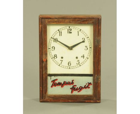 A wall clock, wooden cased and with two train striking movement with Arabic numerals and marked Tempus Fugit to the glass pan