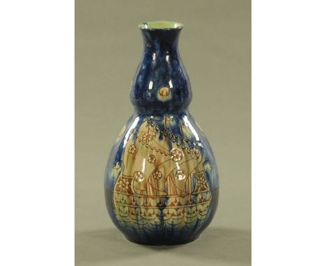 A Della Robbia gourd shaped vase, decorated with ships against a blue ground, incised marks to base.  Height 27 cm (see illus