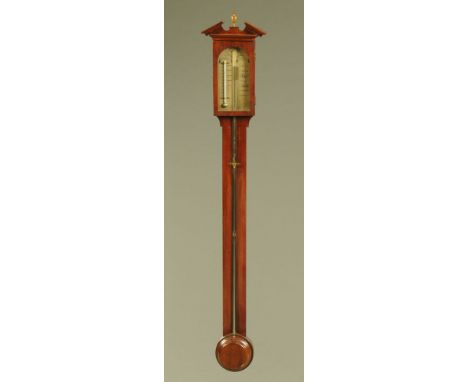 A mahogany stick barometer by Blatt Brighton, in the George III style with turned cistern cover and exposed tube.  Height 100