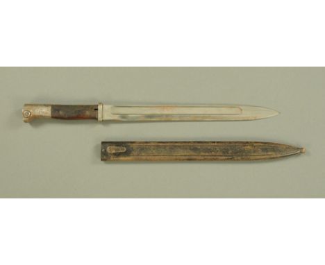 A First World War Bayard bayonet, with metal scabbard. CONDITION REPORT: damage to wooden grip