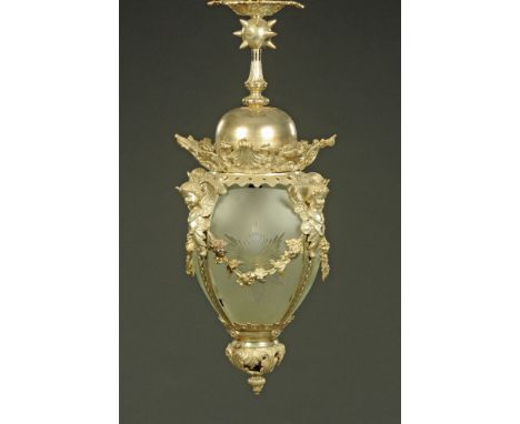 A large metal lantern type light fitting, with etched and cut glass panels.  Height 83 cm, width +/- 35 cm.