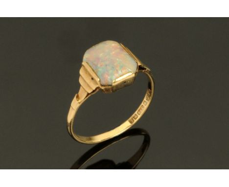 A 9 ct gold Art Deco opal ring,  Size N, stone dimensions 10 mm x 8 mm. CONDITION REPORT: The ring is structurally sound.  Th