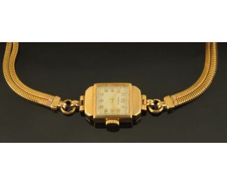 A 9 ct gold cased ladies cocktail watch, by Marvin with Arabic numerals and plated bracelet, manual.