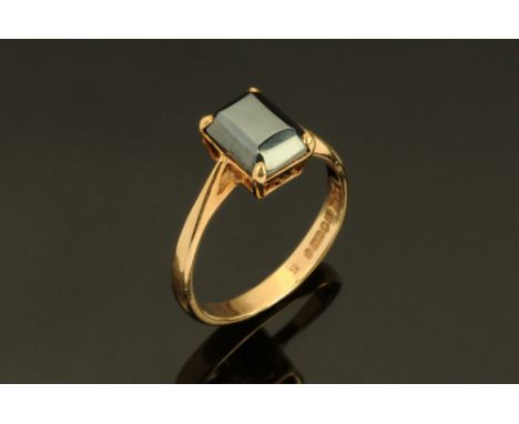 A 9 ct gold ring, with smoky quartz type stone, Size K.