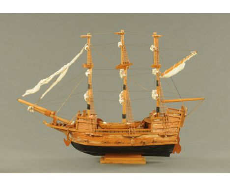 A model galleon, hand built, timber with rigging, last quarter 20th century.  Length 86.5 cm.