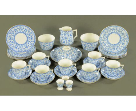 A Royal Crown Derby blue and white tea service, comprising 7 cups, 7 saucers, 9 plates, 2 basins, cream jug, cake dish and li