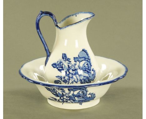 An ironstone blue and white transfer printed toilet jug and basin, basin diameter 31 cm.