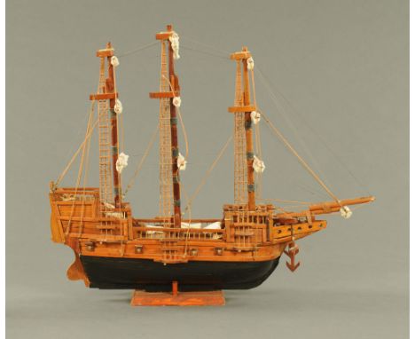 A model galleon, hand built, timber with rigging, last quarter 20th century.  Length 79 cm.