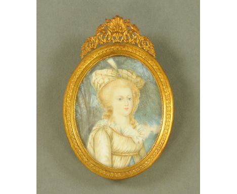 A portrait miniature signed Leiret, depicting a young girl with Indian style headdress.  9 cm x 6.7 cm in oval brass frame.