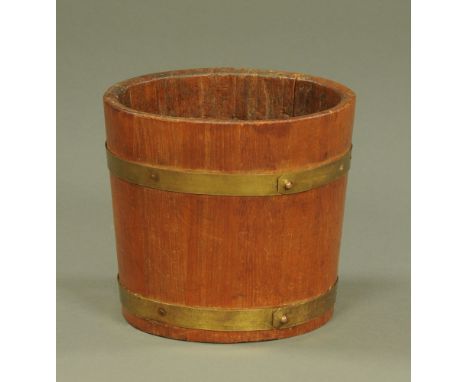 An early 20th century metal bound half barrel planter.  Height 24 cm, diameter 26 cm.