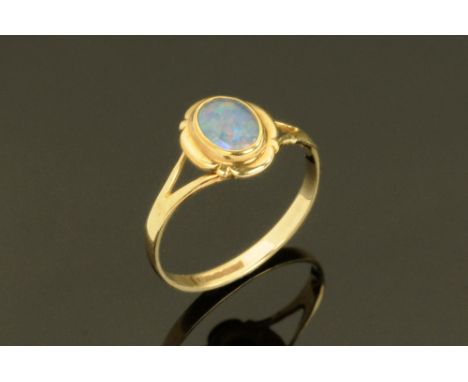 A 9 ct gold opal ring, Size L. CONDITION REPORT: Generally good condition.  There is no significant wear to the shank.  The s