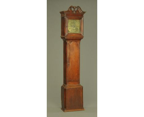 A George III oak longcase clock, with swans neck pediment above the glazed door enclosing the 11" square brass dial and 30 ho