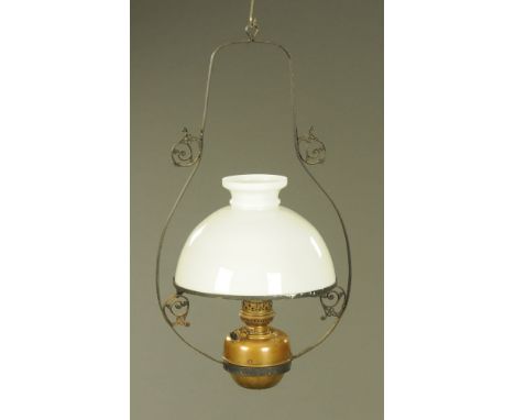 A 19th century hanging oil lamp with glass shade.  Height +/- 80 cm, frame width +/- 44 cm.